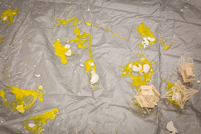 Overhead view of eggs smashed on floor