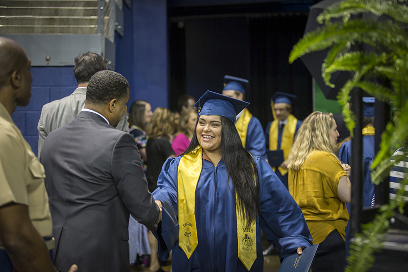shaking hand of female graduate