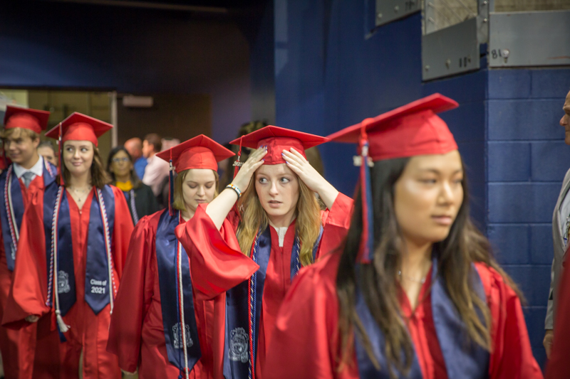 line of graduates - one adjusting hat