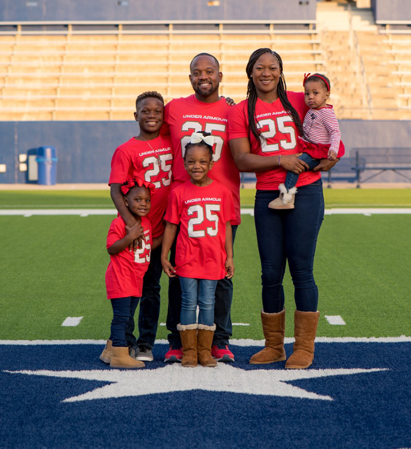 Daniel Foster with his family on the football field