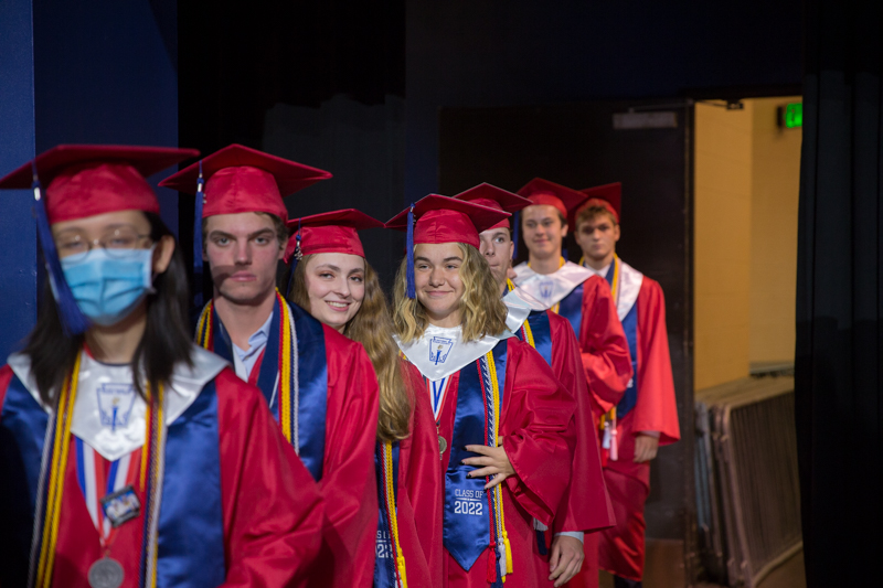 graduates waiting in a line to enter arena