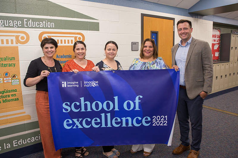 group with banner that reads school of excellence 2021-2022