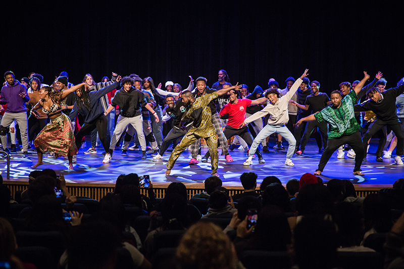 students dancing in unison onstage