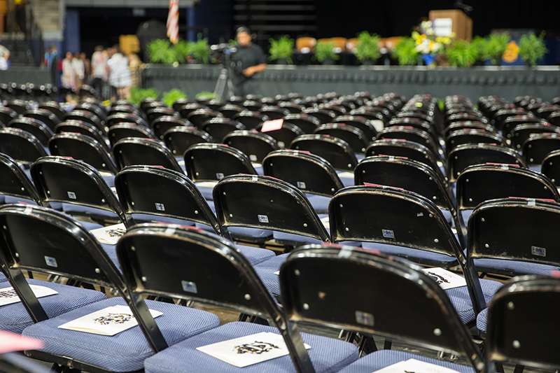 rows of empty graduate seats before ceremony
