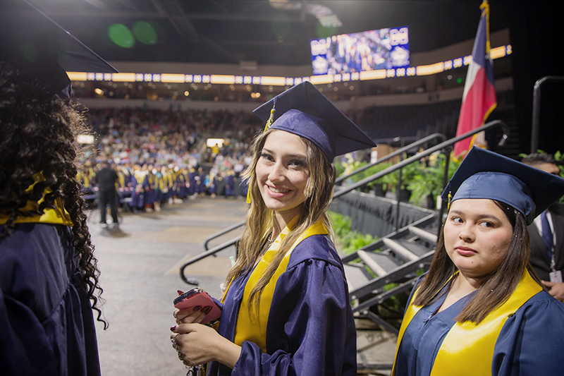 female graduate smiling at camera