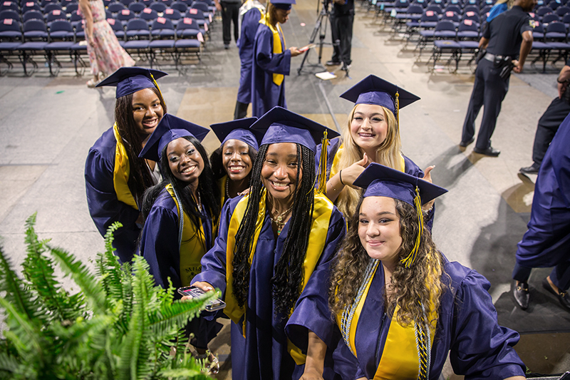 group of MHS female students smiling for camera after graduation