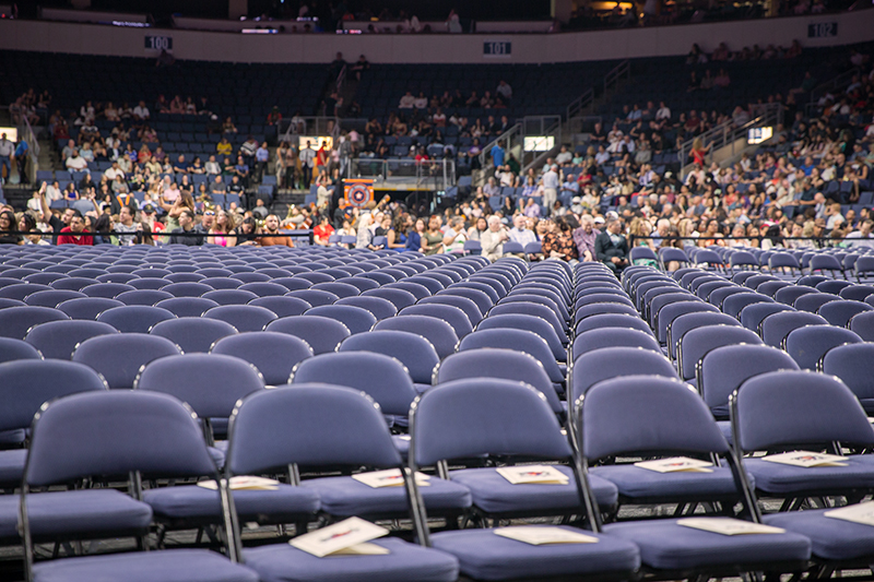 rows up empty grad chairs before ceremony