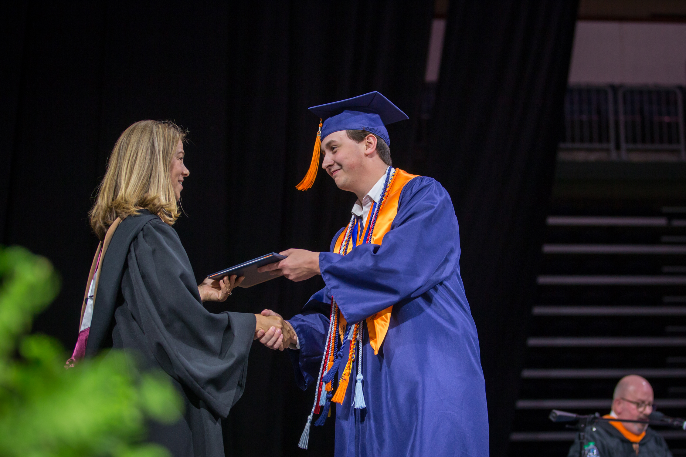 male North student receiving diploma 