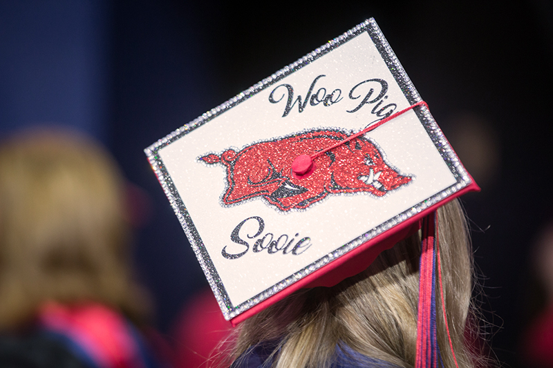 Graduate cap decorated with University of Arkansas logo and Woo Pig Sooie