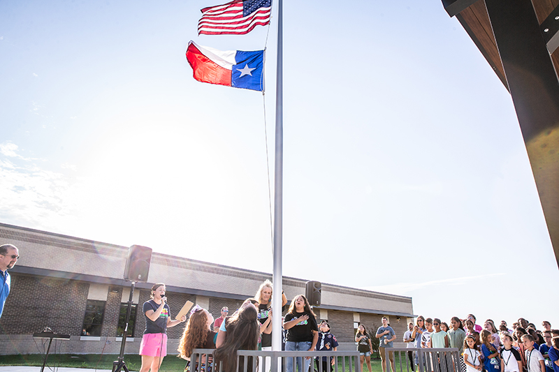 shot of flagpole with flags flying