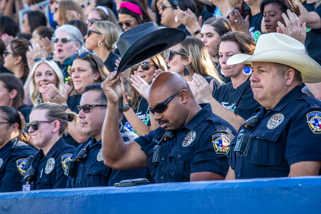 police officer tipping his hat