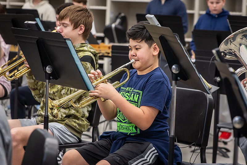 Trumpet players performing in band hall