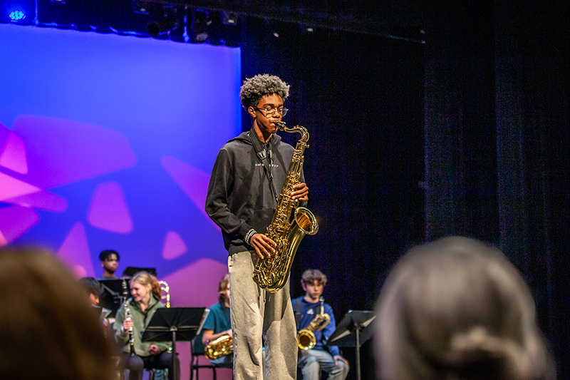 North jazz band solo sax player performing in the auditorium during a fine arts showcase